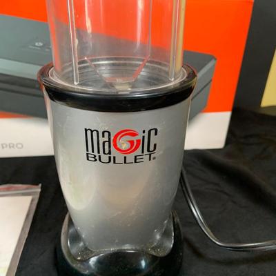 LOT 33: Magic Bullet with Extra Tops and a Anova Vacuum Sealer Pro In Original Box