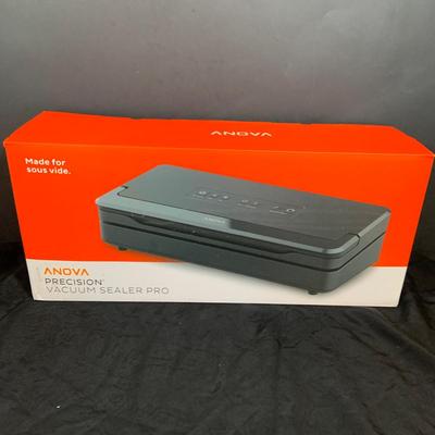 LOT 33: Magic Bullet with Extra Tops and a Anova Vacuum Sealer Pro In Original Box