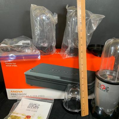 LOT 33: Magic Bullet with Extra Tops and a Anova Vacuum Sealer Pro In Original Box