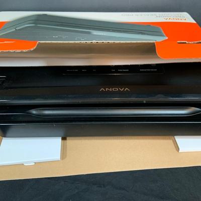 LOT 33: Magic Bullet with Extra Tops and a Anova Vacuum Sealer Pro In Original Box