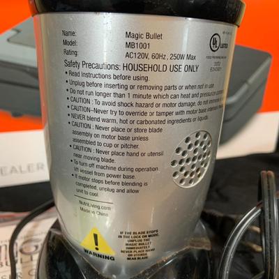 LOT 33: Magic Bullet with Extra Tops and a Anova Vacuum Sealer Pro In Original Box