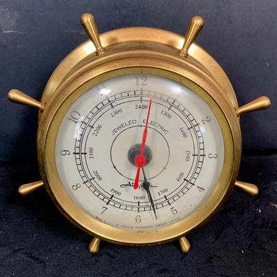 LOT 43: Collection Nautical Instruments Including a Seth Thomas Brass Ships Clock, Brass Ship’s Wheel Barometer and Lorus Quartz World...