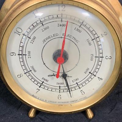 LOT 43: Collection Nautical Instruments Including a Seth Thomas Brass Ships Clock, Brass Ship’s Wheel Barometer and Lorus Quartz World...