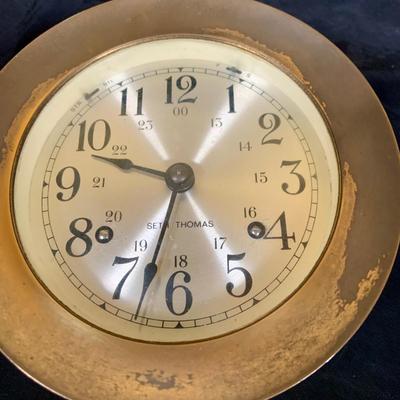 LOT 43: Collection Nautical Instruments Including a Seth Thomas Brass Ships Clock, Brass Ship’s Wheel Barometer and Lorus Quartz World...