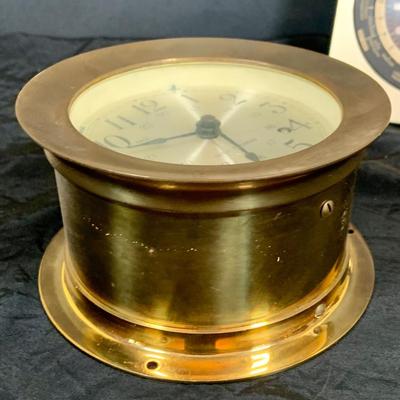 LOT 43: Collection Nautical Instruments Including a Seth Thomas Brass Ships Clock, Brass Ship’s Wheel Barometer and Lorus Quartz World...