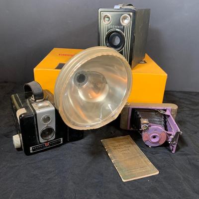 LOT 54: Vintage Camera Collection Including Brownie Hawkeye with Flash, Brownie Box Camera and Kodak Petite Folding Cameria