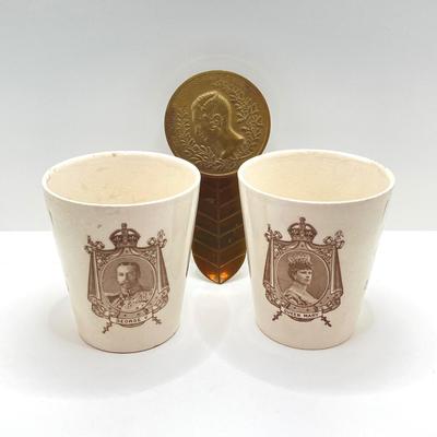 LOT 78: Pair of Antique 1911 Coronation Cups Featuring King George V and Queen Mary by Royal Doulton and Brass Prince Albert Brass Holder