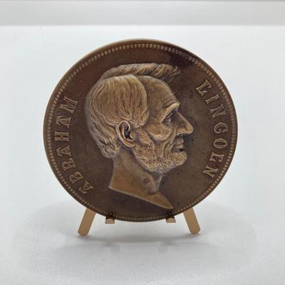 LOT 111: Five Bronze Presidential Medals / Tokens - George Washington with Wooden Stand and Three Abraham Lincoln and More