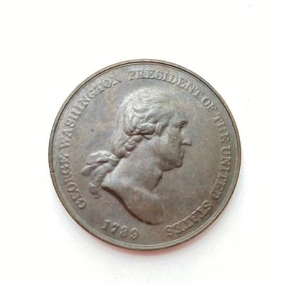 LOT 111: Five Bronze Presidential Medals / Tokens - George Washington with Wooden Stand and Three Abraham Lincoln and More