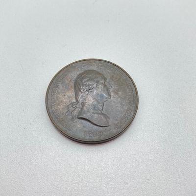 LOT 111: Five Bronze Presidential Medals / Tokens - George Washington with Wooden Stand and Three Abraham Lincoln and More