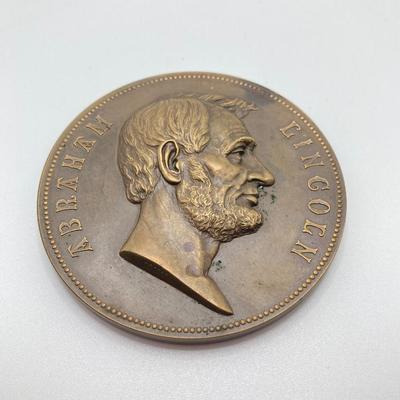 LOT 111: Five Bronze Presidential Medals / Tokens - George Washington with Wooden Stand and Three Abraham Lincoln and More