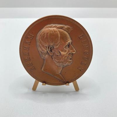 LOT 111: Five Bronze Presidential Medals / Tokens - George Washington with Wooden Stand and Three Abraham Lincoln and More