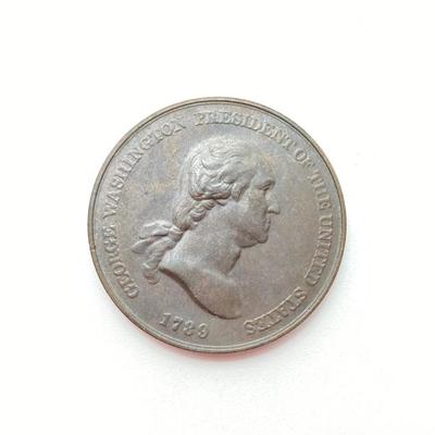LOT 111: Five Bronze Presidential Medals / Tokens - George Washington with Wooden Stand and Three Abraham Lincoln and More