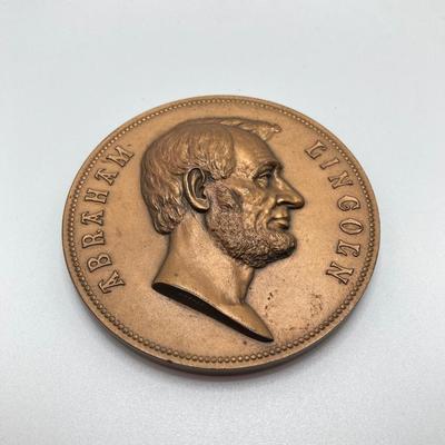 LOT 111: Five Bronze Presidential Medals / Tokens - George Washington with Wooden Stand and Three Abraham Lincoln and More