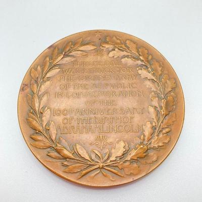 LOT 111: Five Bronze Presidential Medals / Tokens - George Washington with Wooden Stand and Three Abraham Lincoln and More
