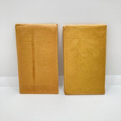 LOT 135: 1956 and 1957 U.S. Philadelphia Mint Coin Proof Sets sealed Original Envelopes