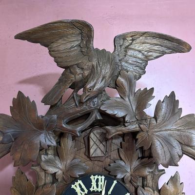 LOT 146: Vintage G.K. Cuckoo Clock with "Portrait" Pendulum