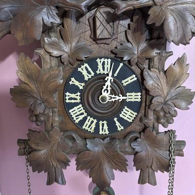 LOT 146: Vintage G.K. Cuckoo Clock with "Portrait" Pendulum