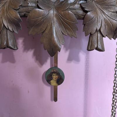 LOT 146: Vintage G.K. Cuckoo Clock with "Portrait" Pendulum