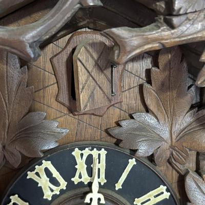 LOT 146: Vintage G.K. Cuckoo Clock with "Portrait" Pendulum
