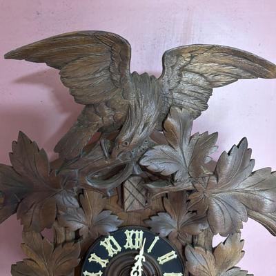 LOT 146: Vintage G.K. Cuckoo Clock with "Portrait" Pendulum
