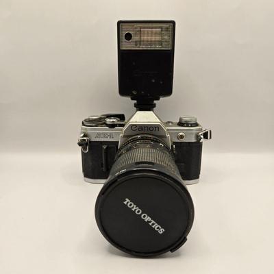 LOT 163F: Vintage Cannon AE-1 Camera with Hoya 67mm Lens