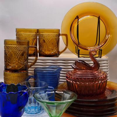 LOT 212D: Multiple Pieces of Colorful Glass Including Amber Plates, Amber Cups Made in France, 3 Pieces of Blue Glass, Candy Dish with...