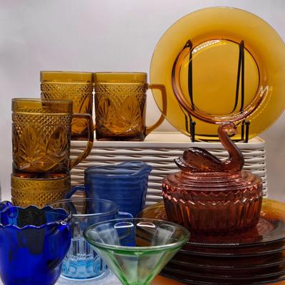 LOT 212D: Multiple Pieces of Colorful Glass Including Amber Plates, Amber Cups Made in France, 3 Pieces of Blue Glass, Candy Dish with...