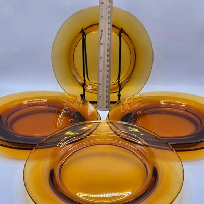 LOT 212D: Multiple Pieces of Colorful Glass Including Amber Plates, Amber Cups Made in France, 3 Pieces of Blue Glass, Candy Dish with...