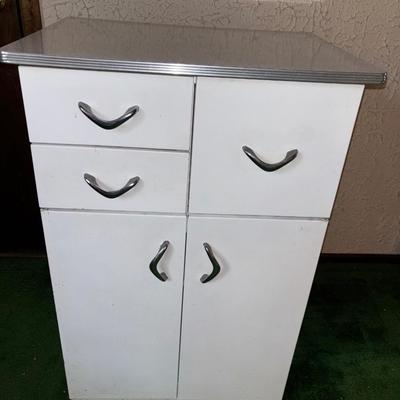 LOT 925Den: Vintage metal white speckled top utility cabinet