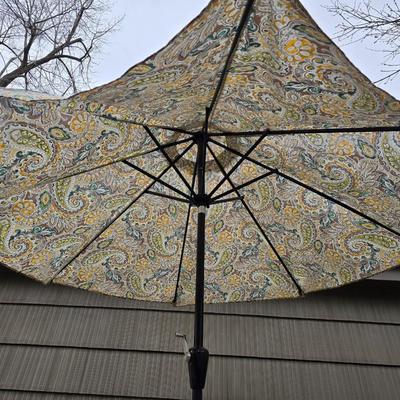Like new crank style umbrella with umbrella stand