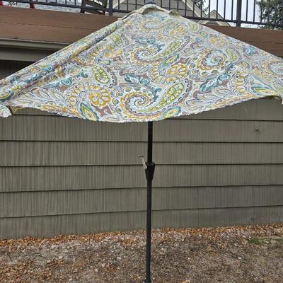 Like new crank style umbrella with umbrella stand