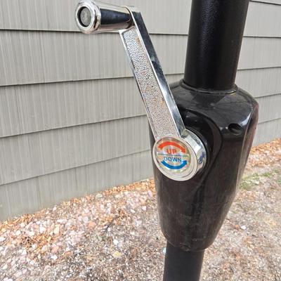 Like new crank style umbrella with umbrella stand