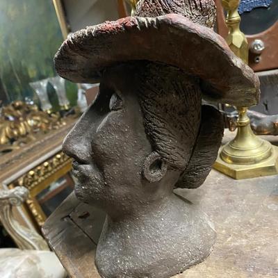 Woman with hat and earrings sculpture, Heavy metal Bronze?