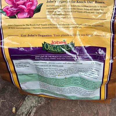 Garden pot with stand - partial bag of rose food - crafting moss - and a unopened bag of Odla hydroponic clay beads