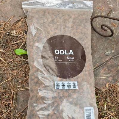 Garden pot with stand - partial bag of rose food - crafting moss - and a unopened bag of Odla hydroponic clay beads