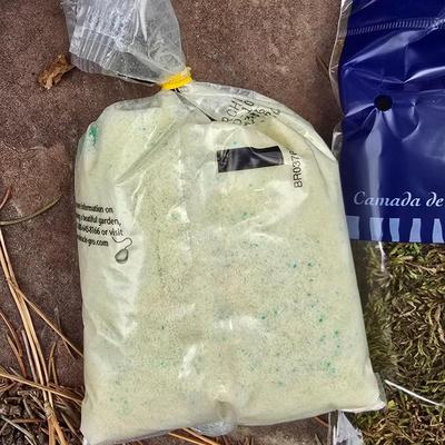 Garden pot with stand - partial bag of rose food - crafting moss - and a unopened bag of Odla hydroponic clay beads