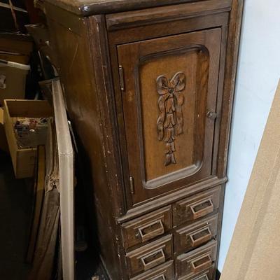 Antique storage cabinet with card catalog drawers