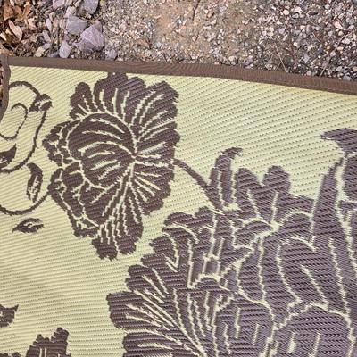 Shade sail and a smaller sized outdoor reversible area rug 57" x 35.5