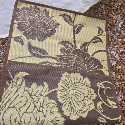 Shade sail and a smaller sized outdoor reversible area rug 57" x 35.5