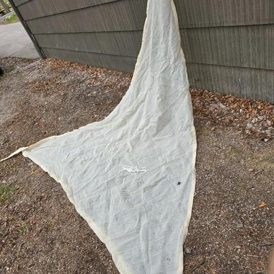 Shade sail and a smaller sized outdoor reversible area rug 57" x 35.5