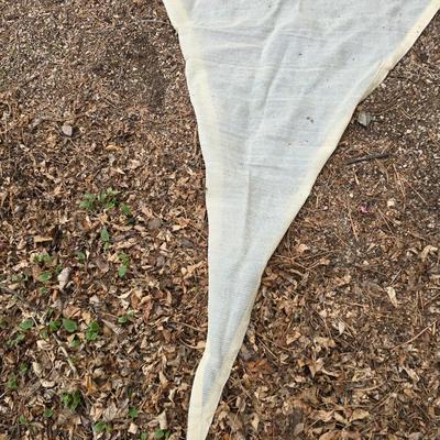 Shade sail and a smaller sized outdoor reversible area rug 57" x 35.5