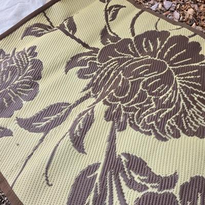 Shade sail and a smaller sized outdoor reversible area rug 57" x 35.5
