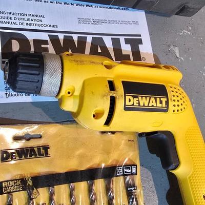 Electric Dewalt 3/8" V.S.R. Drill with case, instruction manual, and a few accessories