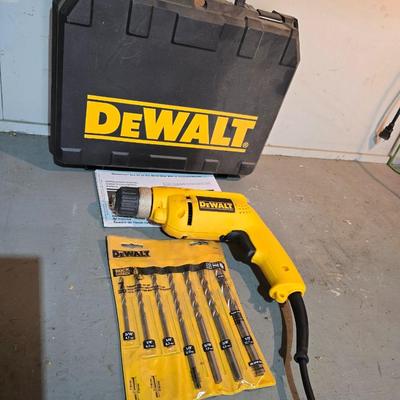 Electric Dewalt 3/8" V.S.R. Drill with case, instruction manual, and a few accessories