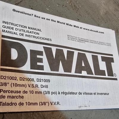 Electric Dewalt 3/8" V.S.R. Drill with case, instruction manual, and a few accessories