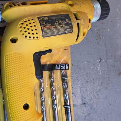 Electric Dewalt 3/8" V.S.R. Drill with case, instruction manual, and a few accessories