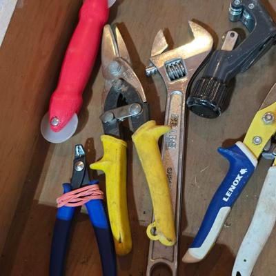 Wood organizing tray full of a variety of handtools