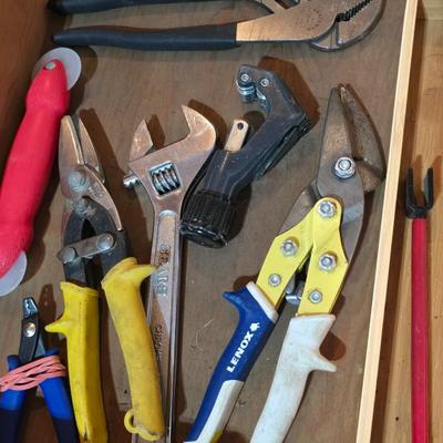 Wood organizing tray full of a variety of handtools