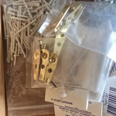 Assortment of home hardware - new caster wheels - screws - nails - Large rat traps - new in the bag hardware